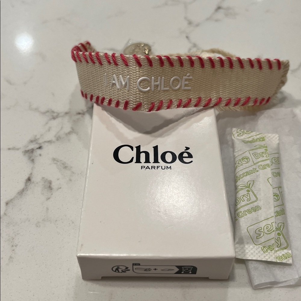 Chloé Parfum Cream and Pink Fabric Bracelet with Tassel and Gold Charm NWT